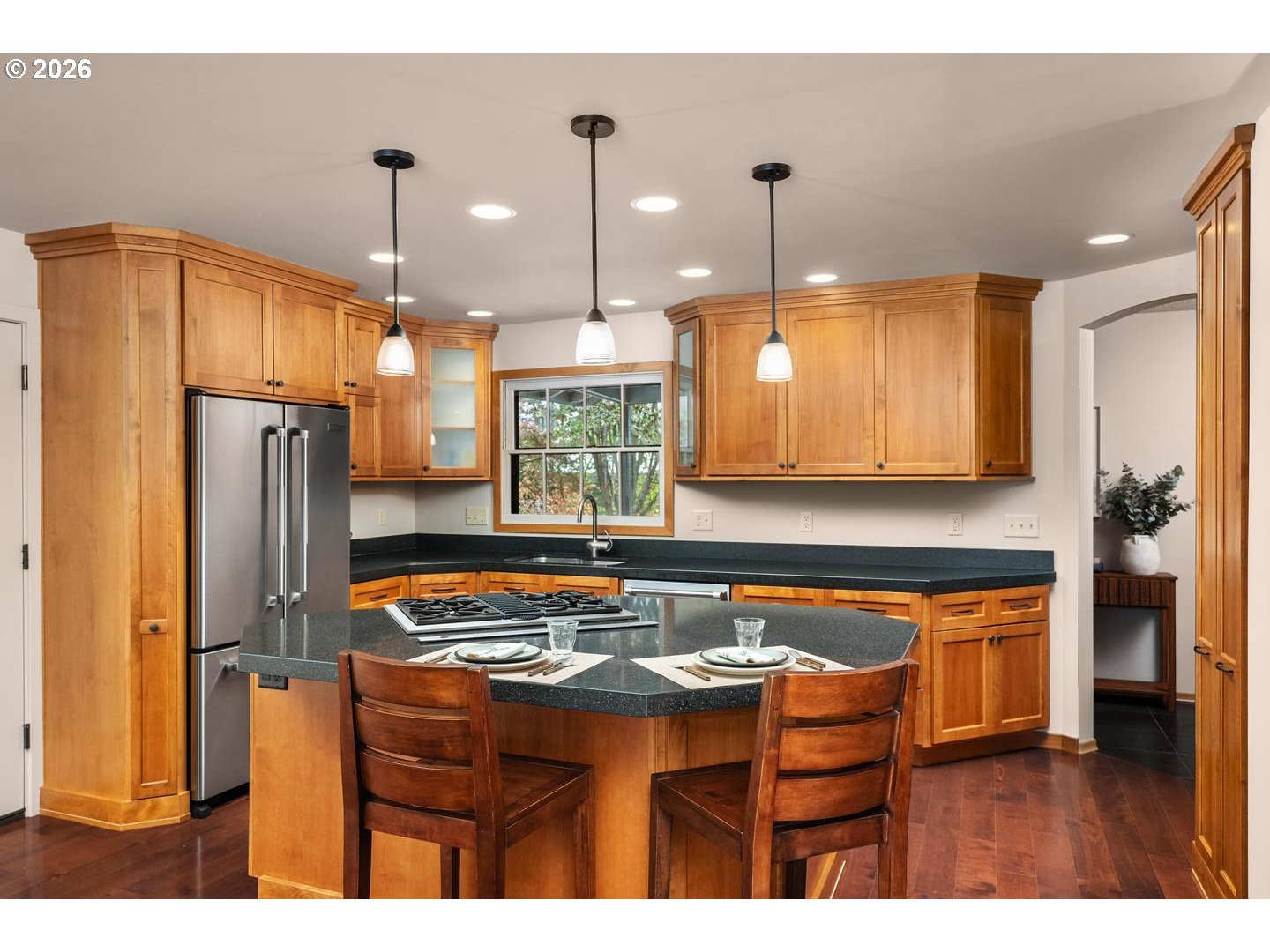 3005 Southwest 113th Avenue Beaverton, OR 97005 - Photo 9 of 30 a kitchen with stainless steel appliances granite countertop a sink refrigerator and cabinets