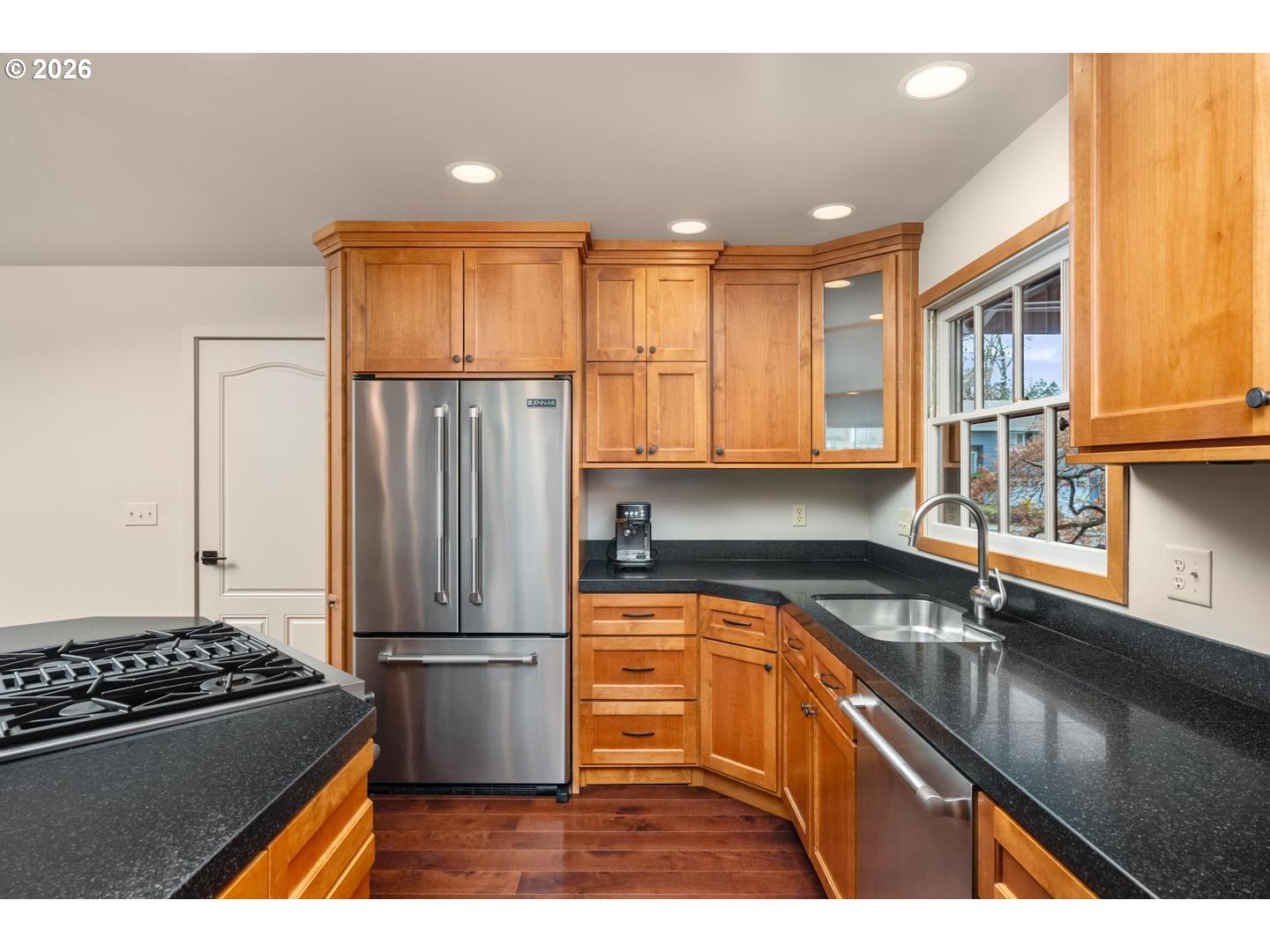 3005 Southwest 113th Avenue Beaverton, OR 97005 - Photo 10 of 30 a kitchen with granite countertop a refrigerator and a sink