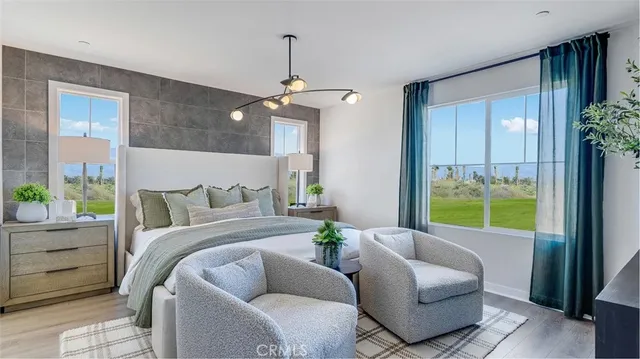 a bedroom with a bed and a couch