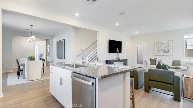 a view of living room with granite countertop furniture and fireplace