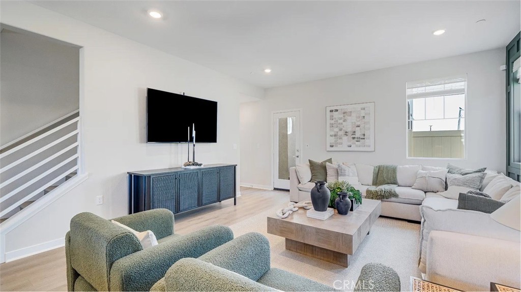 1721 Eagle Road Rialto, CA 92376 - Photo 7 of 23 a living room with furniture and a flat screen tv