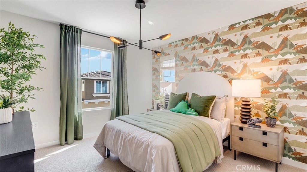 1721 Eagle Road Rialto, CA 92376 - Photo 8 of 23 a bedroom with a large bed and a chandelier