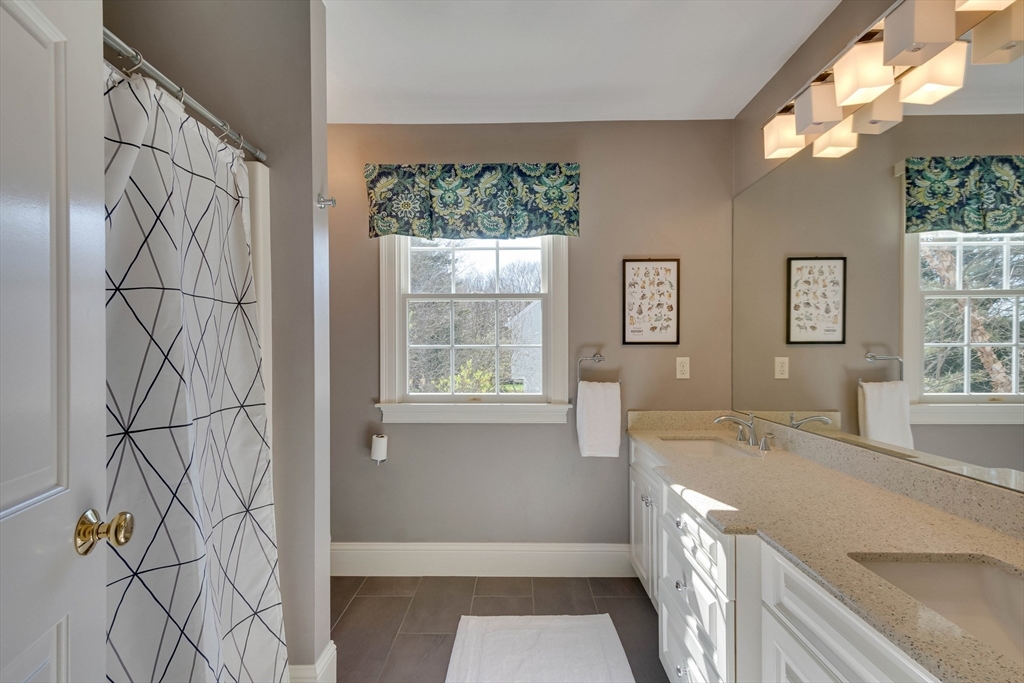 29 Old Bridge Road Concord, MA 01742 - Photo 20 of 40 a spacious bathroom with a bathtub and a sink