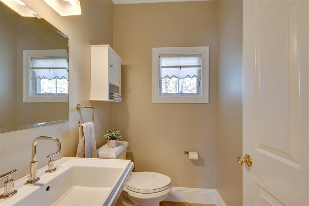 29 Old Bridge Road Concord, MA 01742 - Photo 24 of 40 a bathroom with a toilet a sink and mirror