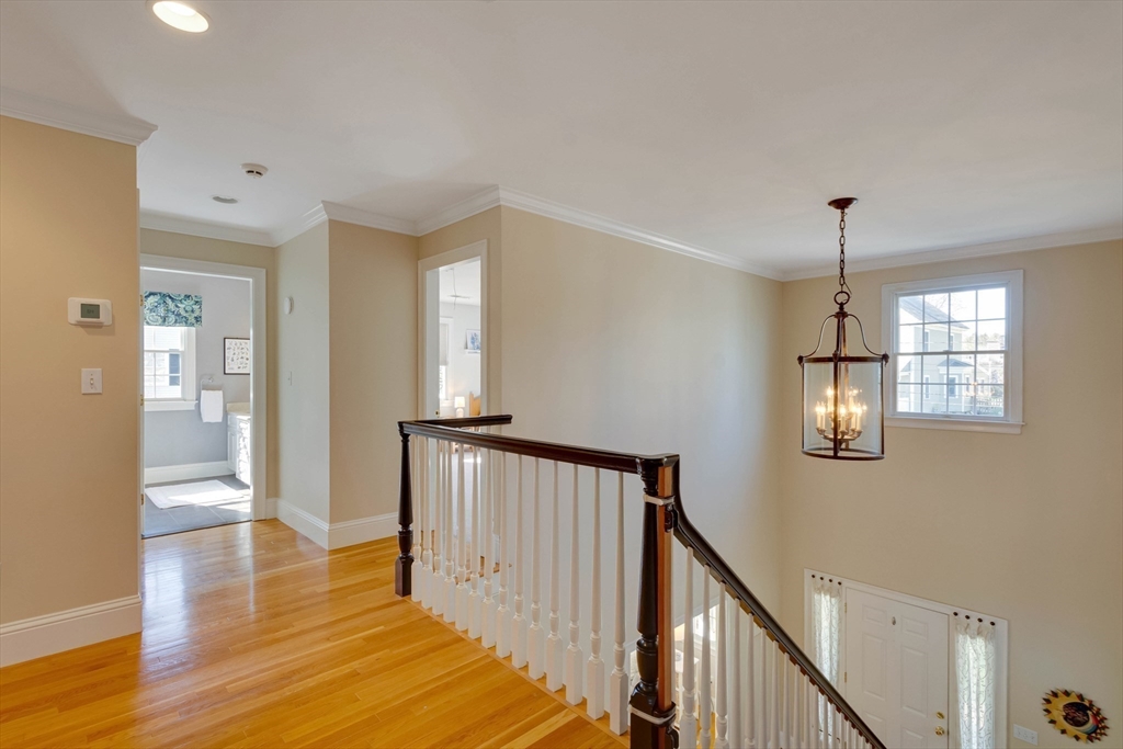 29 Old Bridge Road Concord, MA 01742 - Photo 28 of 40 a view of a hallway with wooden floor and staircase