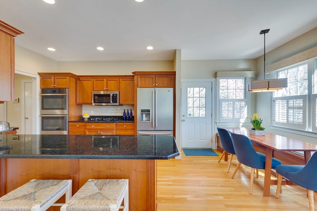 29 Old Bridge Road Concord, MA 01742 - Photo 3 of 40 a large kitchen with a table and chairs in it