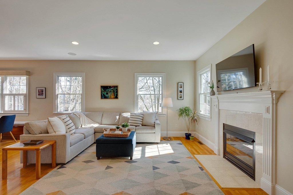 29 Old Bridge Road Concord, MA 01742 - Photo 5 of 40 a living room with furniture a flat screen tv and a fireplace