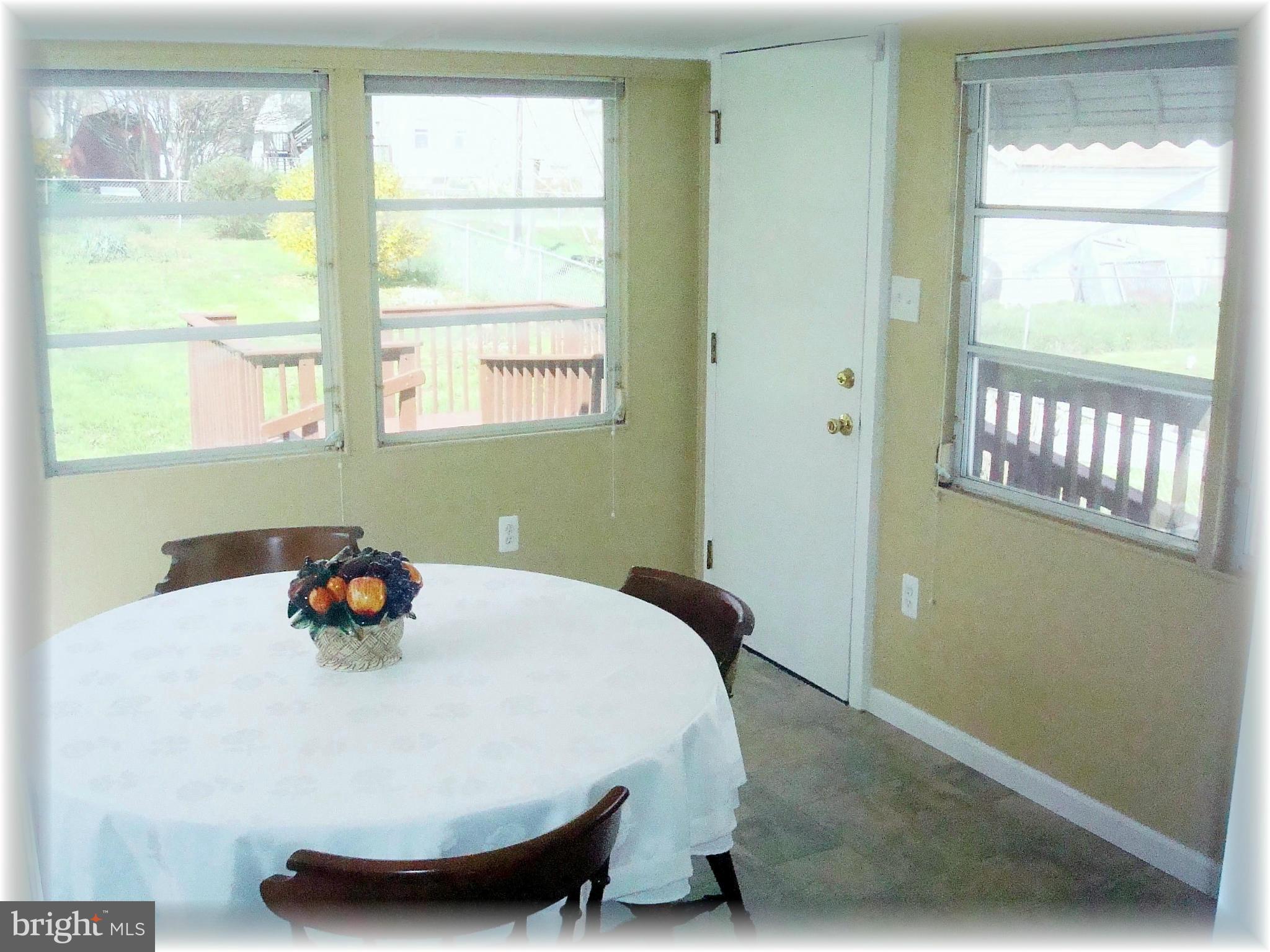 372 Stillwater Road Baltimore, MD 21221 - Photo 16 of 29 Sunroom / dining room w/abundant natural light