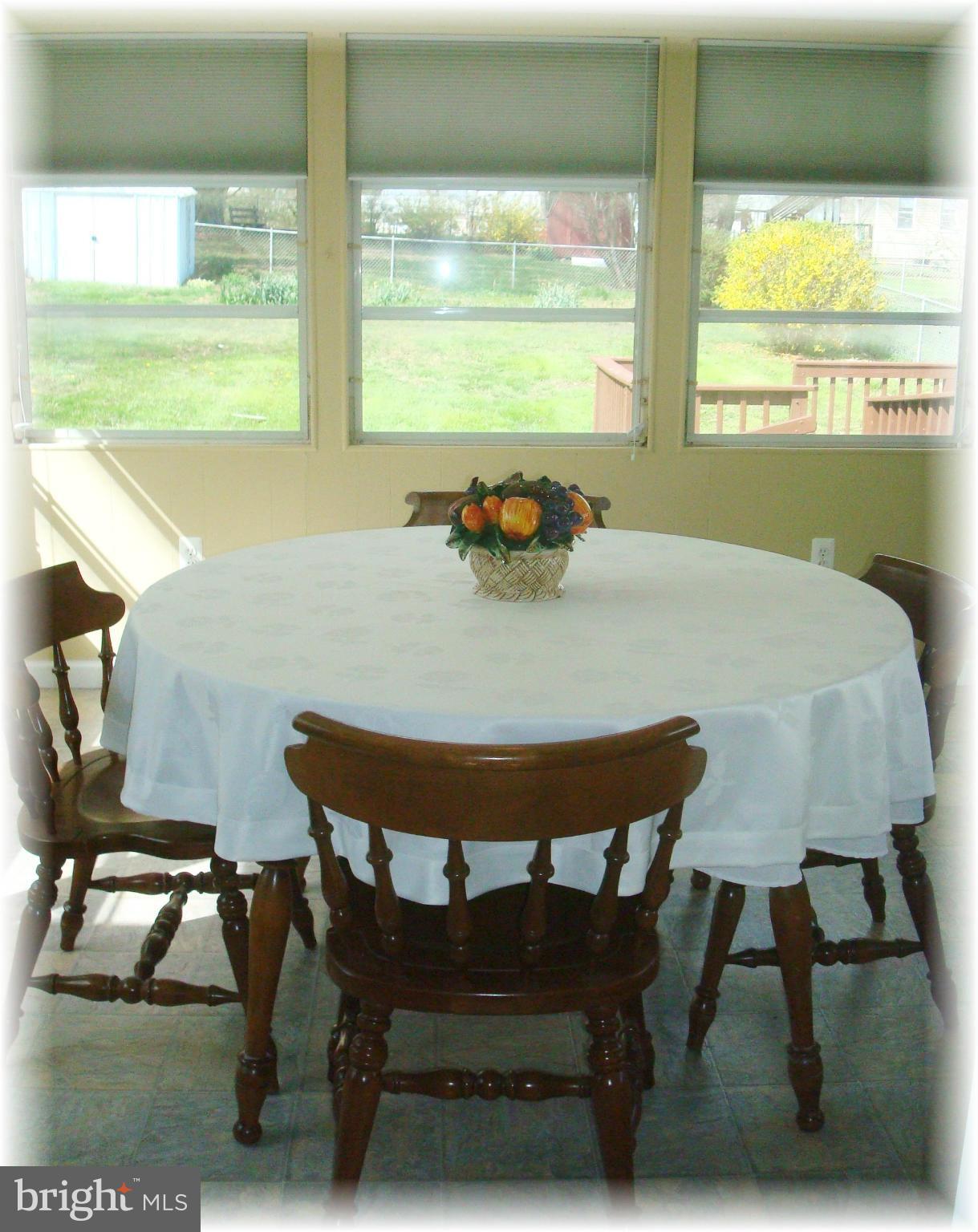372 Stillwater Road Baltimore, MD 21221 - Photo 17 of 29 Sun room / dining room directly off of the kitchen