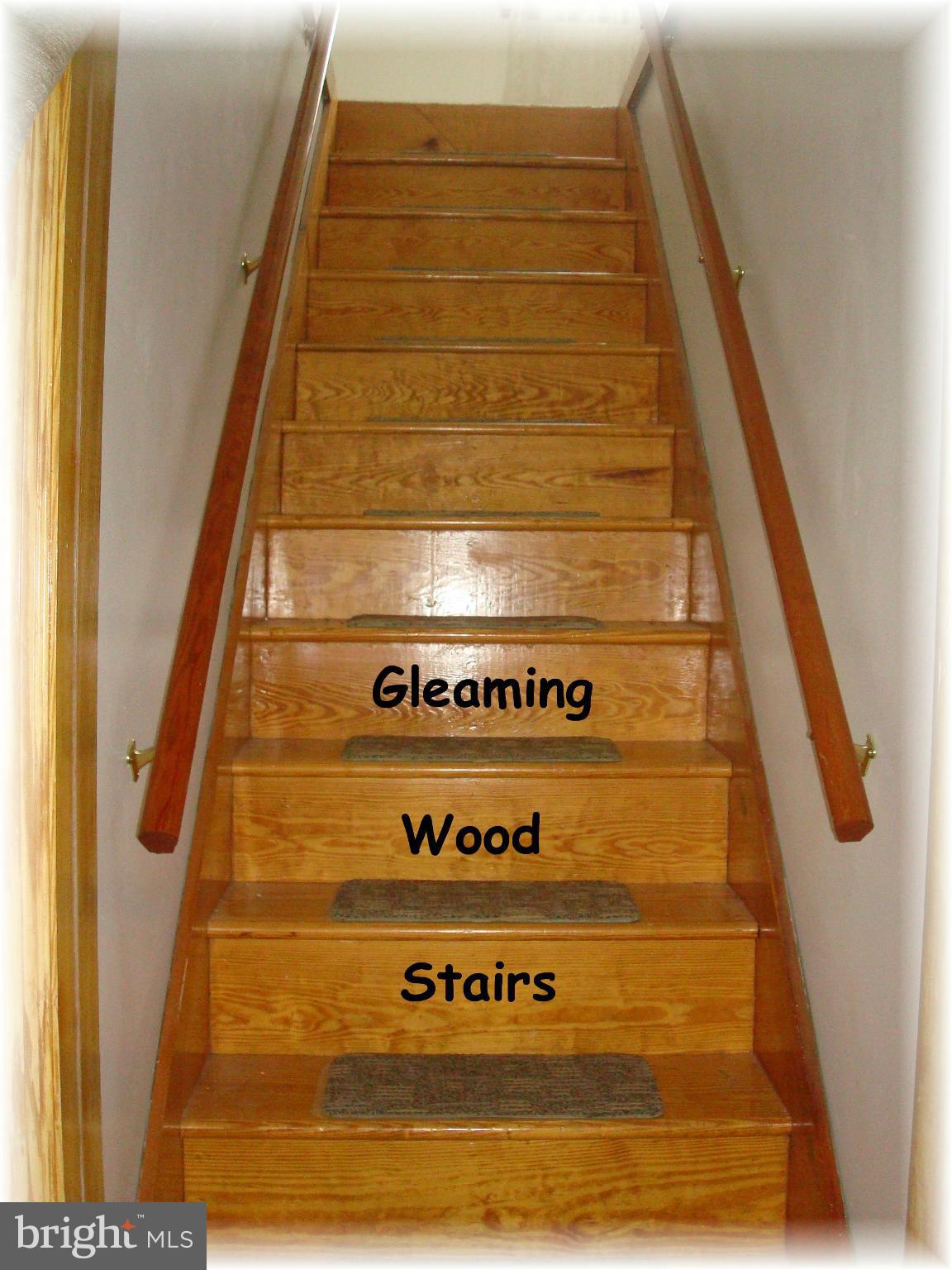 372 Stillwater Road Baltimore, MD 21221 - Photo 23 of 29 Hardwood stair lead to the largest bedroom of all.