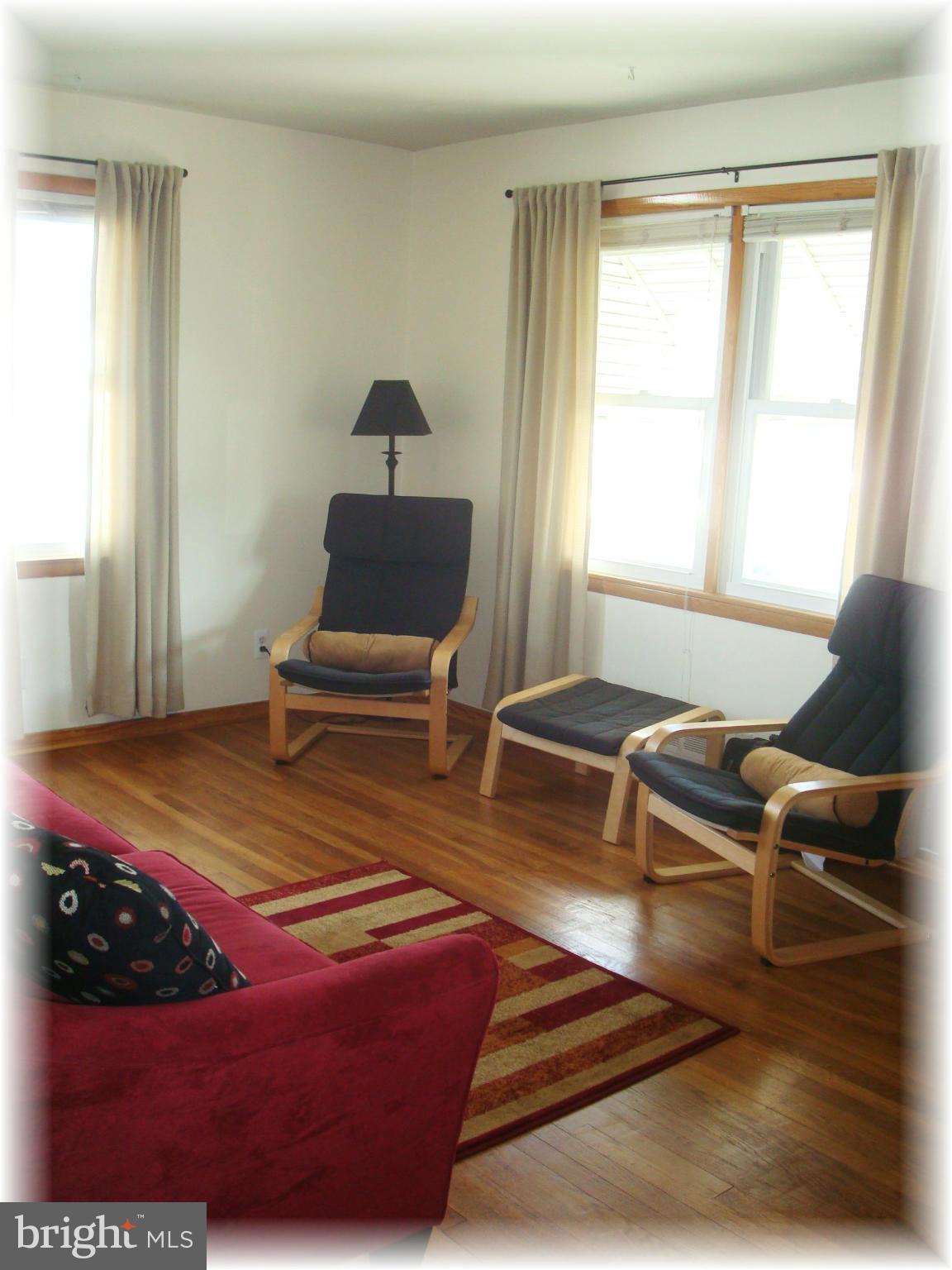 372 Stillwater Road Baltimore, MD 21221 - Photo 7 of 29 Features gleaming hardwood floors.
