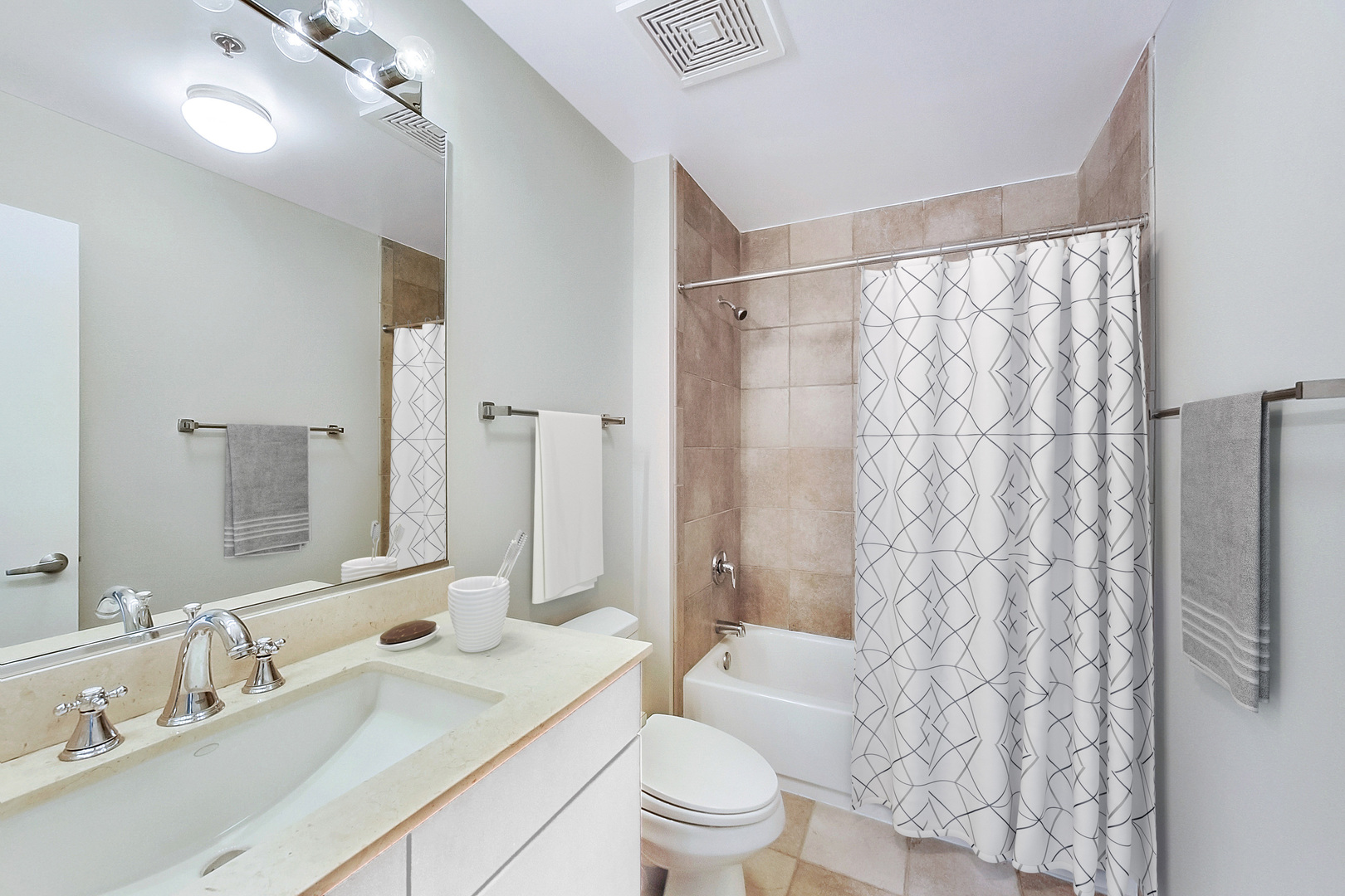 740 West Fulton Street, Unit 905 Chicago, IL 60661 - Photo 16 of 23 a bathroom with a sink a toilet a mirror a vanity and shower