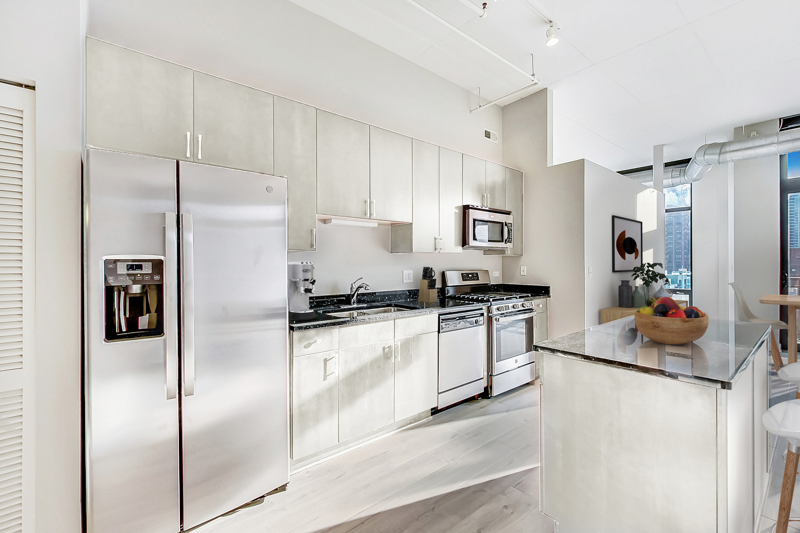 740 West Fulton Street, Unit 905 Chicago, IL 60661 - Photo 10 of 23 a kitchen with stainless steel appliances a refrigerator sink and microwave