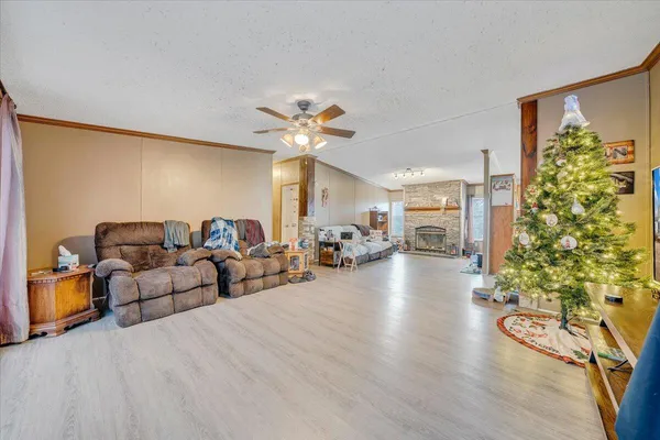 a living room with furniture and a chandelier
