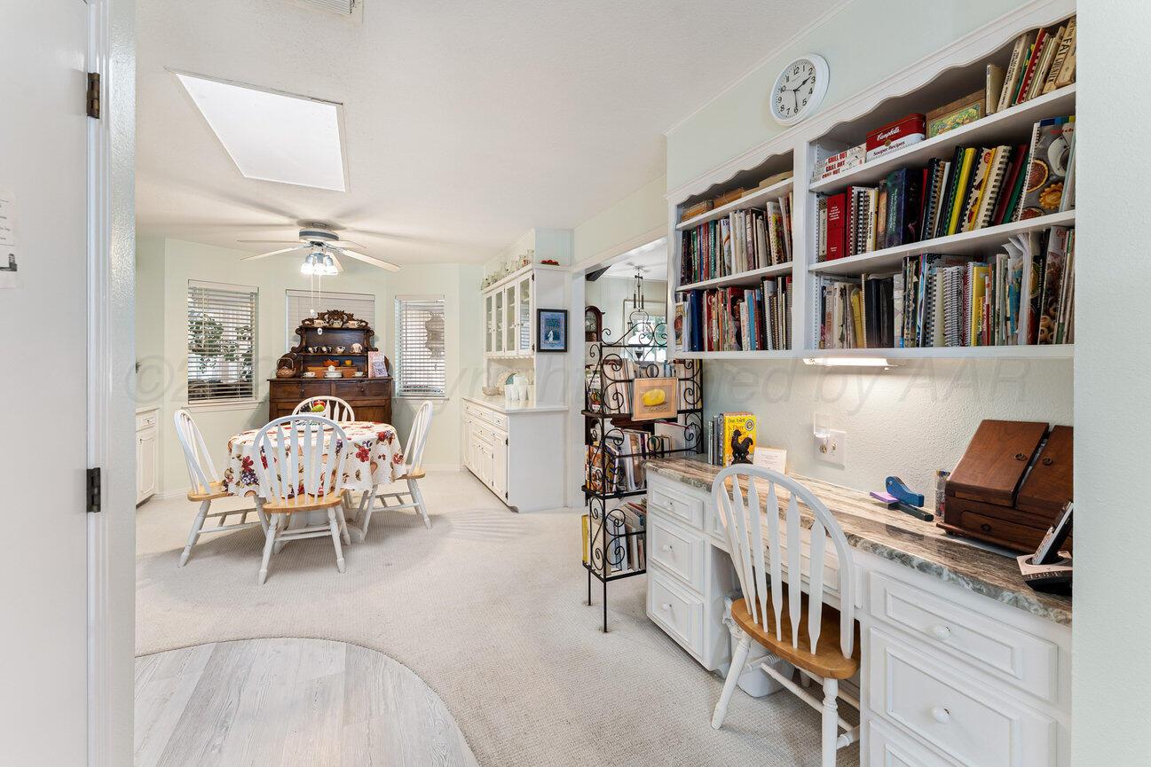 201 Carson Avenue Dumas, TX 79029 - Photo 17 of 55 a reading room with furniture and book shelf