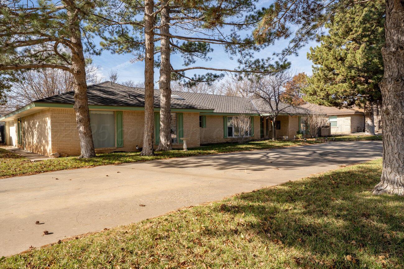 201 Carson Avenue Dumas, TX 79029 - Photo 2 of 55 a front view of a building with a road