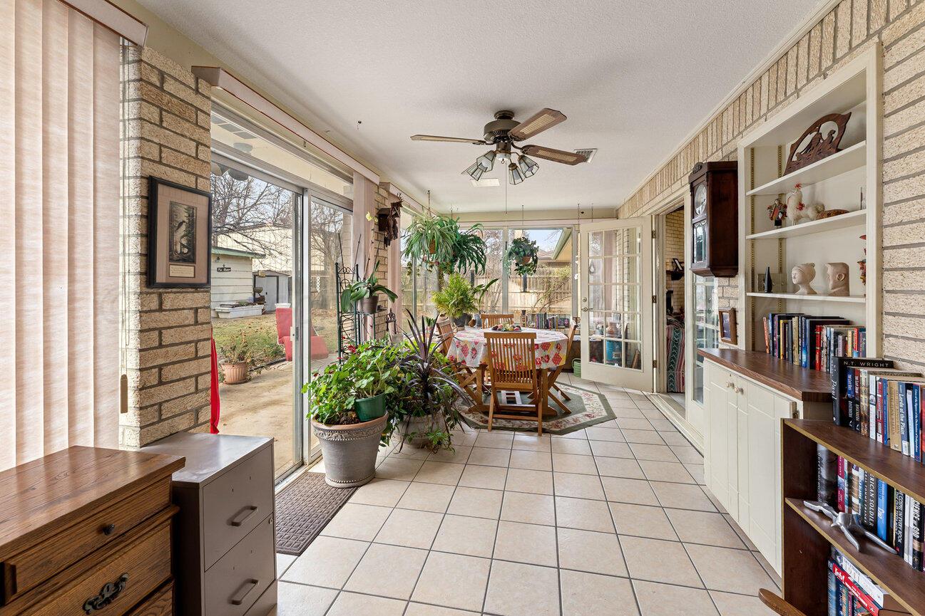 201 Carson Avenue Dumas, TX 79029 - Photo 46 of 55 a living room with furniture and a book shelf