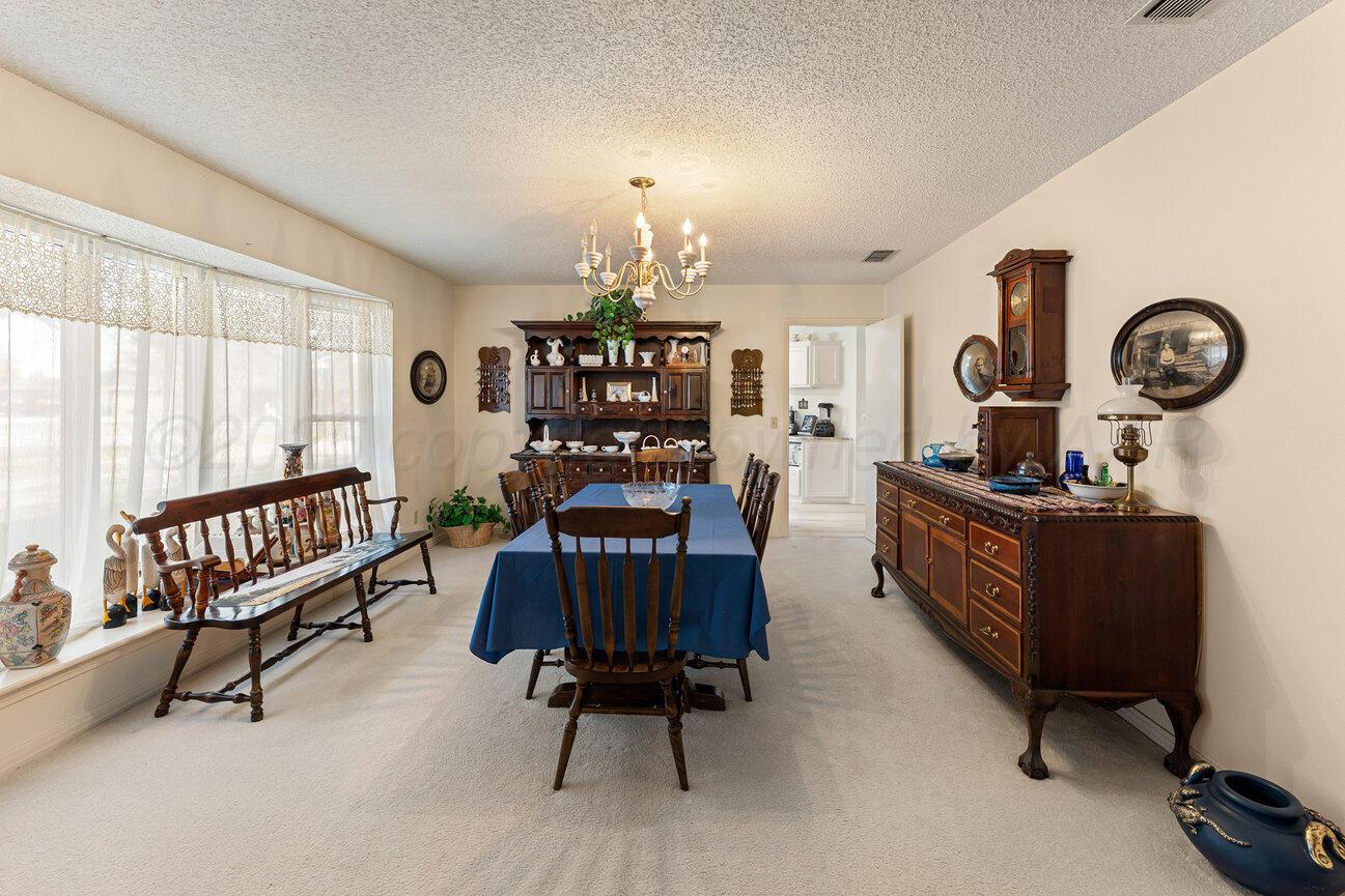 201 Carson Avenue Dumas, TX 79029 - Photo 5 of 55 a living room with furniture and a window