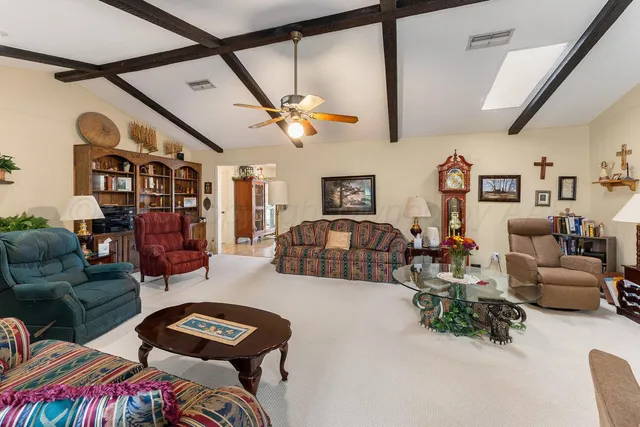 a bathroom with a sink a mirror and a shower curtain