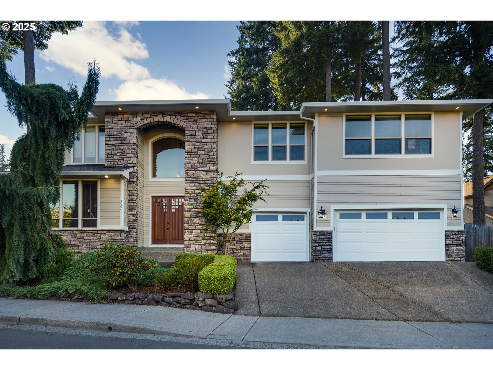 1006 Southeast 199th Avenue Camas, WA 98607 - Photo 1 of 33 a front view of a house with a garden