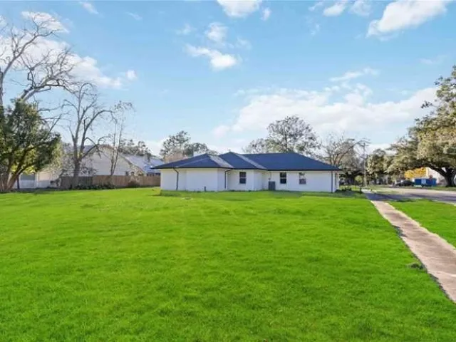 a view of a house with a big yard