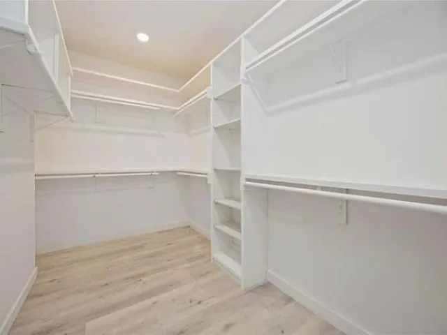 a view of an empty walk in closet