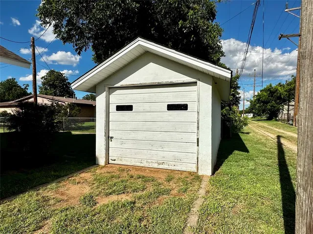a view of house with backyard