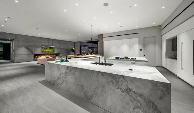 a large room with kitchen view