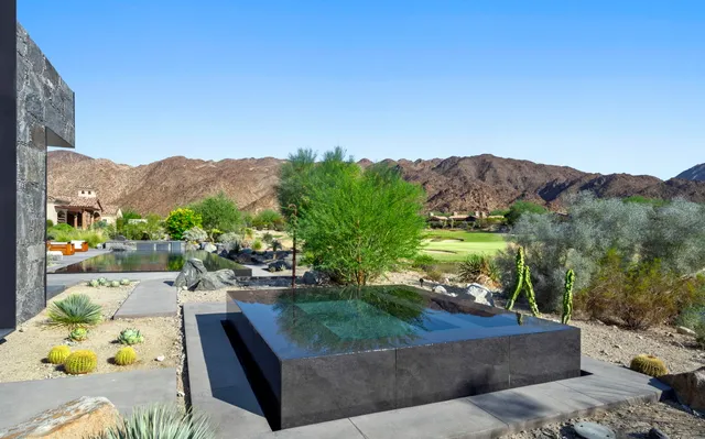a view of a couches and a table in the patio