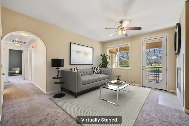 a living room with furniture and a window