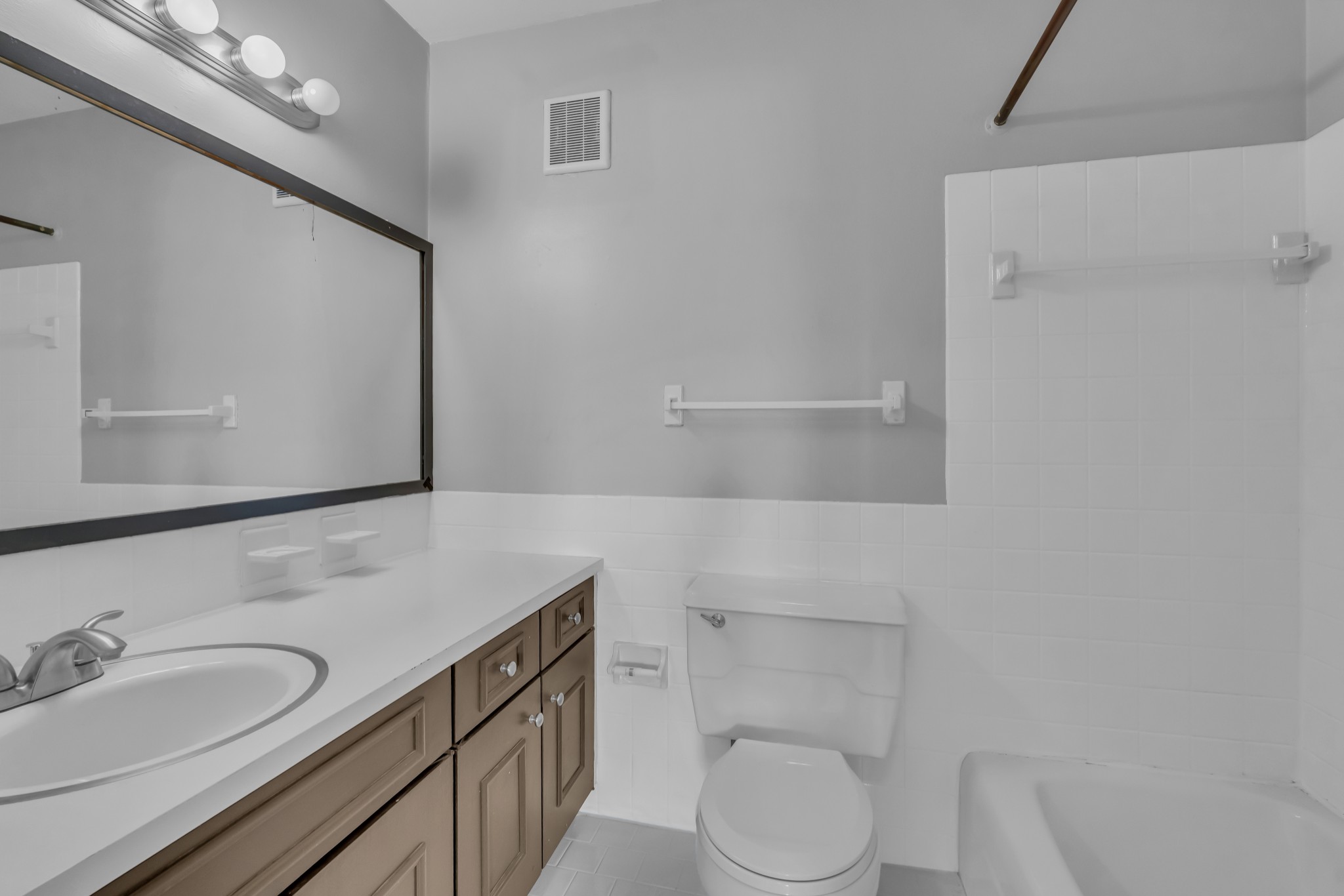 1900 Richard Jones Road, Unit R8 Nashville, TN 37215 - Photo 17 of 21 a bathroom with a sink a toilet and mirror