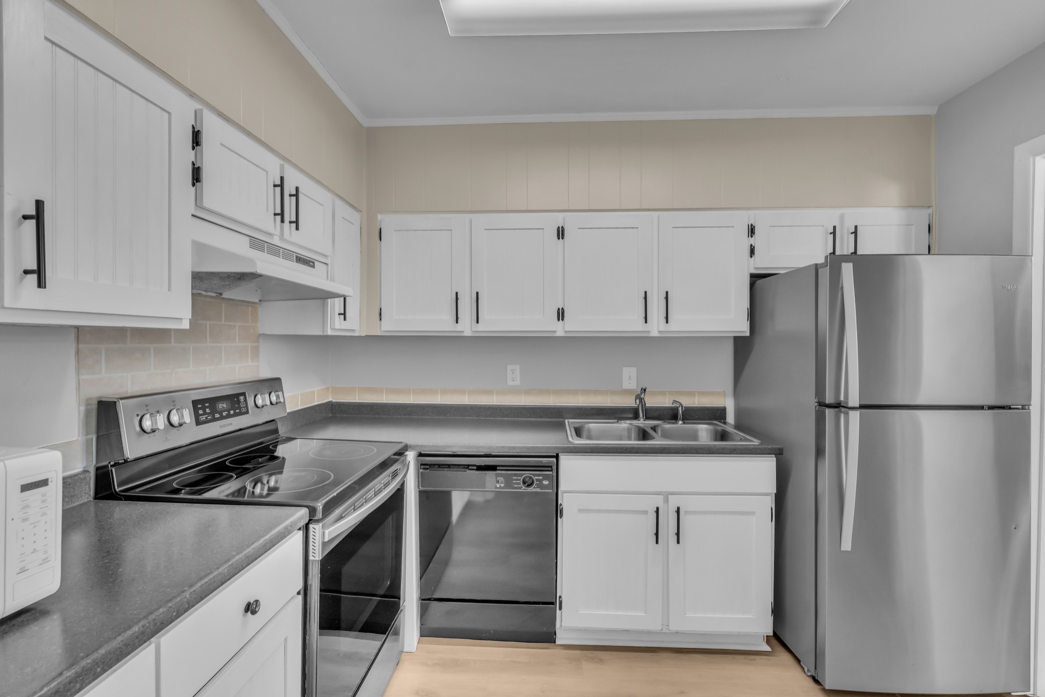 1900 Richard Jones Road, Unit R8 Nashville, TN 37215 - Photo 9 of 21 a kitchen with white cabinets and white appliances