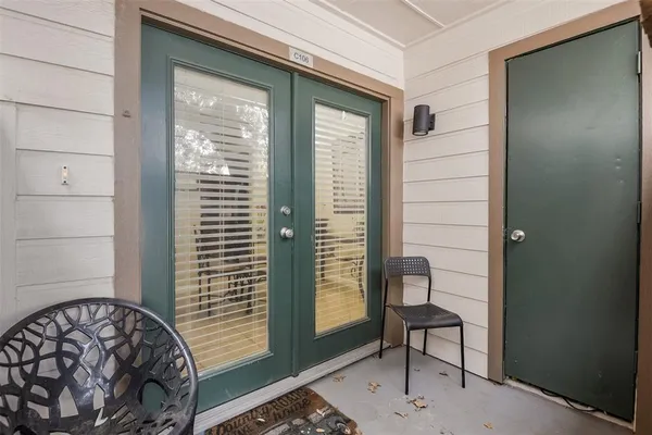a view of a room that has a bed and a window in it