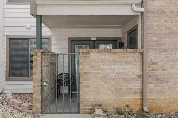 a view of a room with furniture and a potted plant