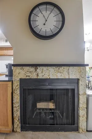 a view of fireplace and a chandelier