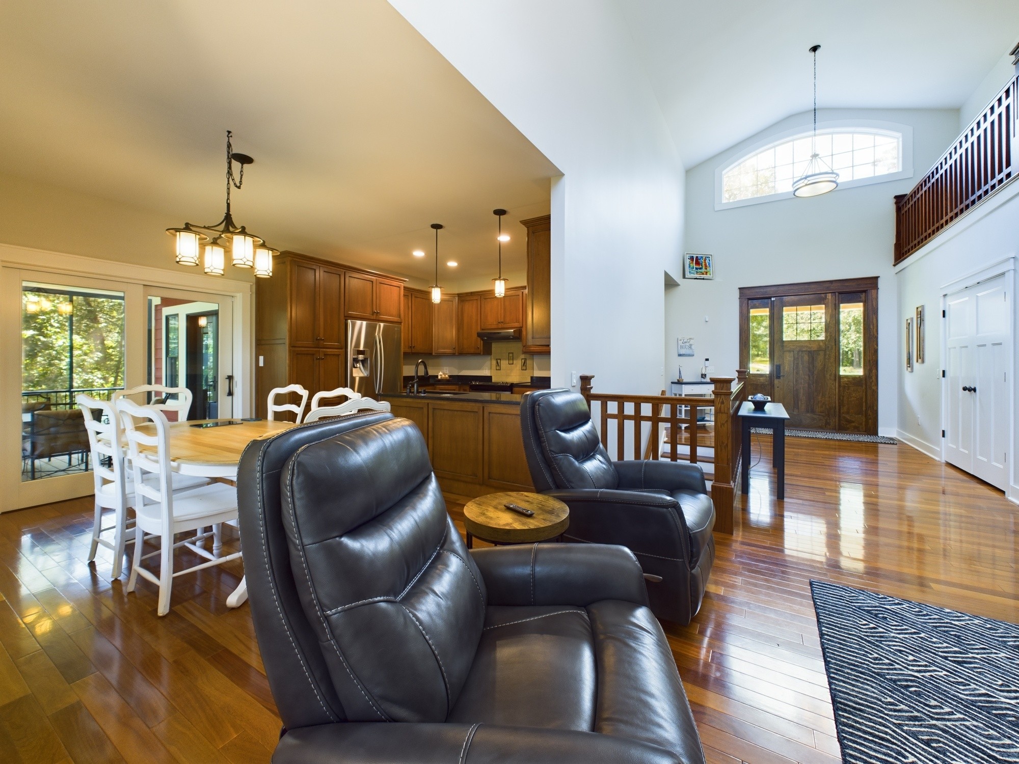 240 Weekend Lane Murray, KY 42071 - Photo 12 of 65 a dining room with furniture a chandelier and wooden floor