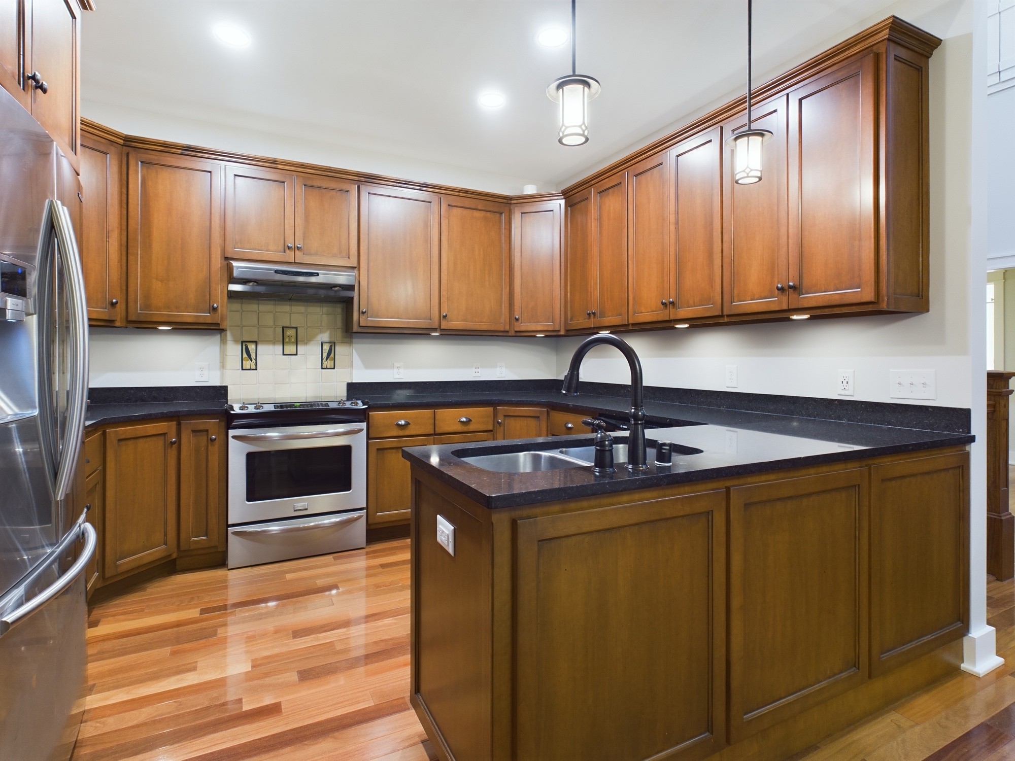 240 Weekend Lane Murray, KY 42071 - Photo 14 of 65 a kitchen with stainless steel appliances granite countertop a sink a stove and cabinets