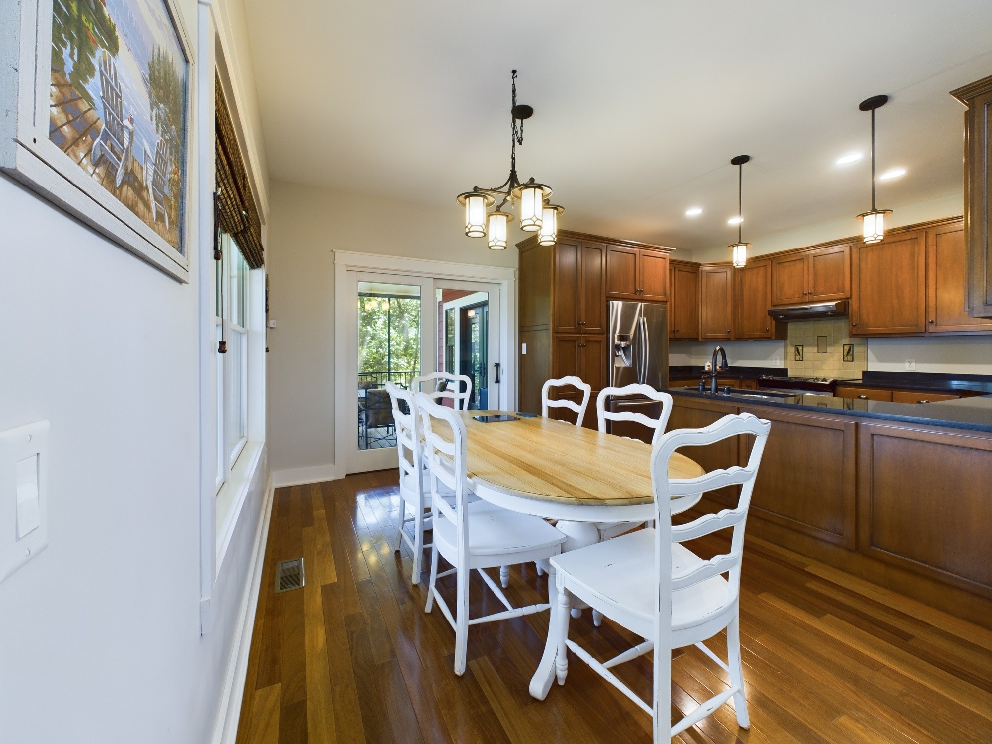240 Weekend Lane Murray, KY 42071 - Photo 15 of 65 a view of a dining room with furniture and wooden floor