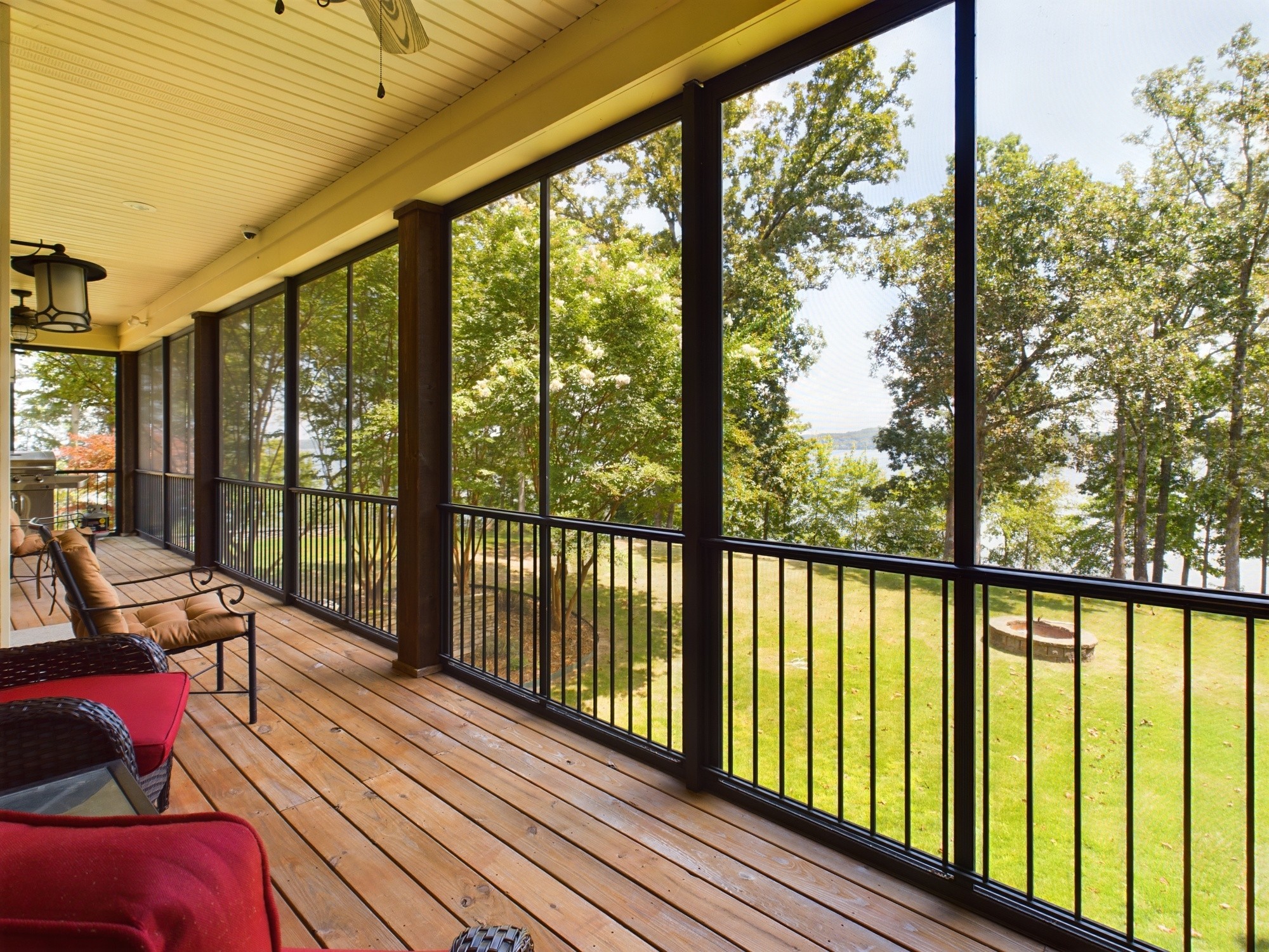 240 Weekend Lane Murray, KY 42071 - Photo 39 of 65 a view of a balcony with couch and wooden floor
