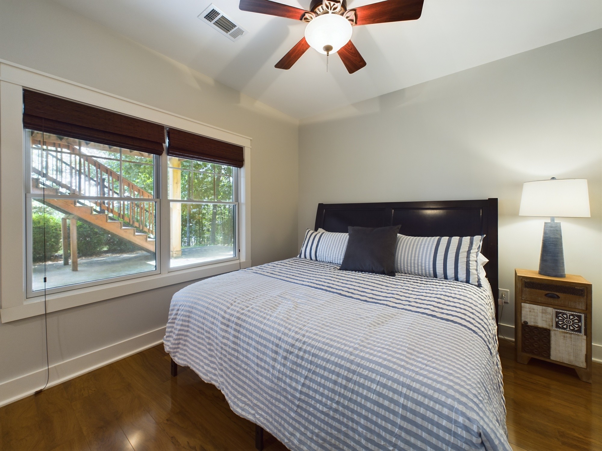 240 Weekend Lane Murray, KY 42071 - Photo 52 of 65 a bedroom with a large bed and a large window