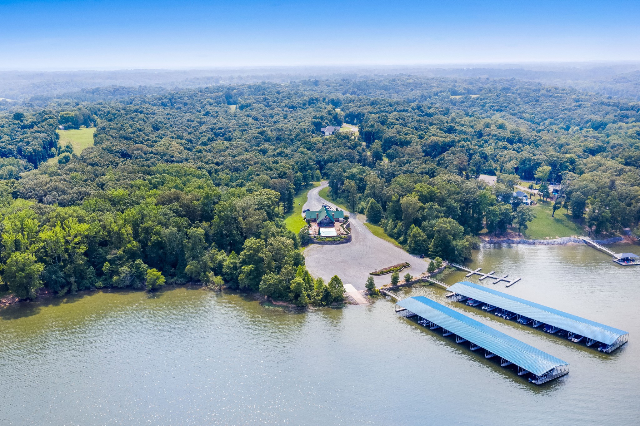 240 Weekend Lane Murray, KY 42071 - Photo 65 of 65 an aerial view of residential houses with outdoor space and lake view