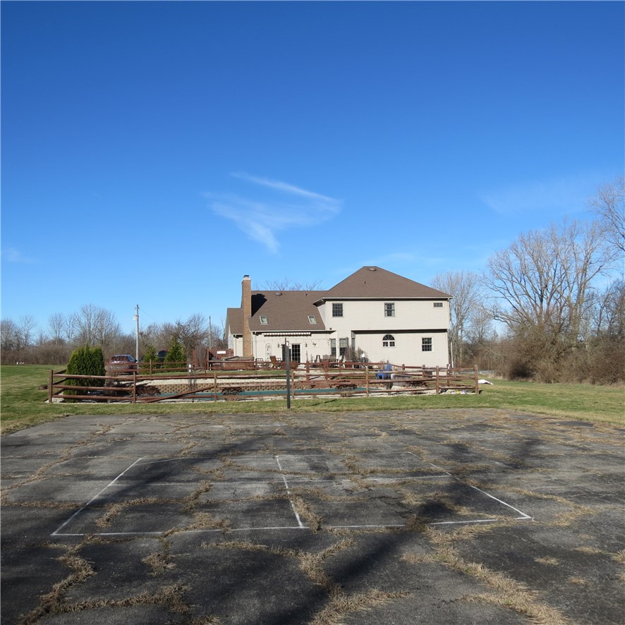 10160 Lochard Road Sidney, OH 45365 - Photo 38 of 41 This spacious property offers outdoor recreation with a house in the background.