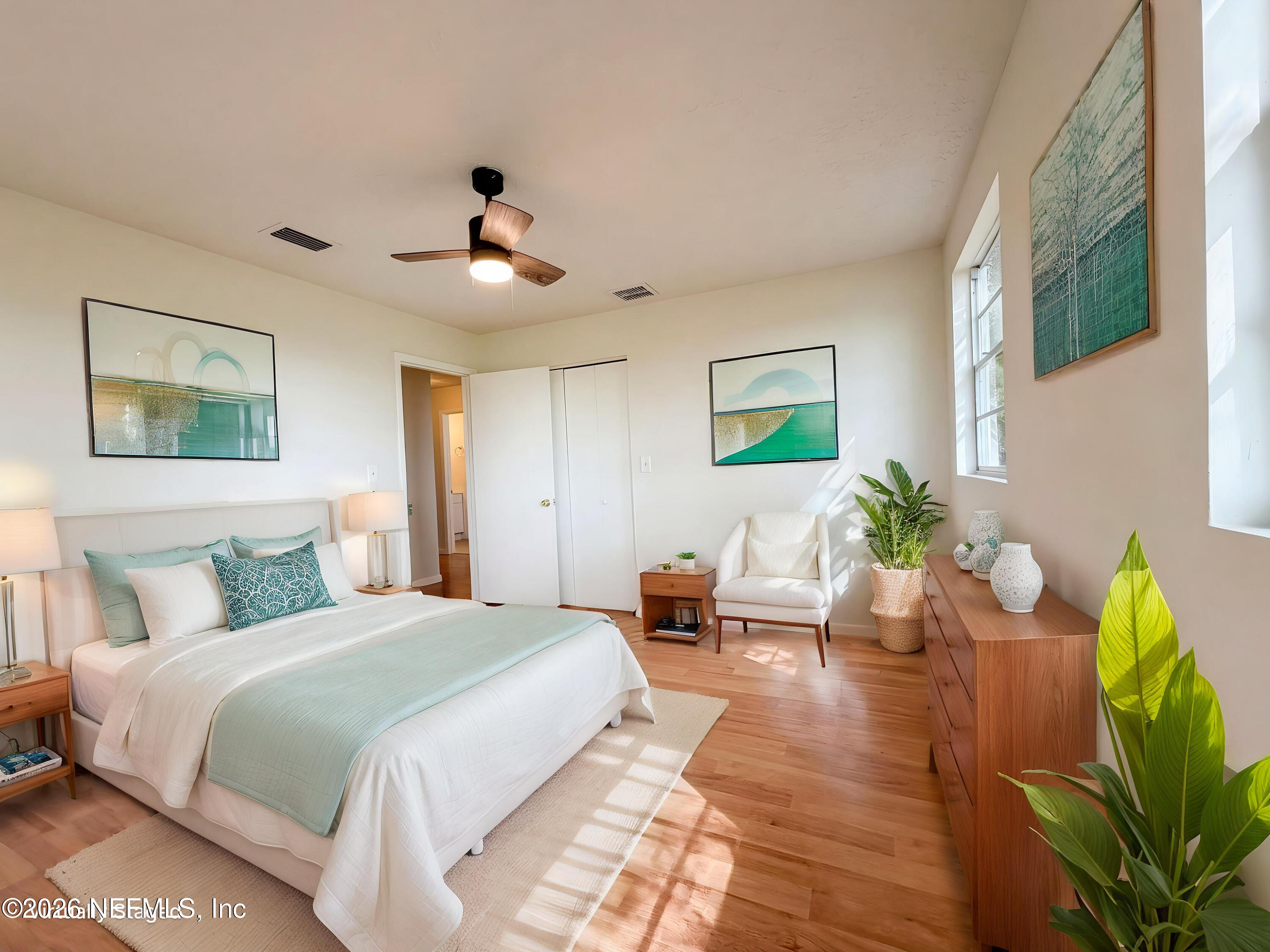 6917 Gatorbone Road Keystone Heights, FL 32656 - Photo 11 of 24 a bedroom with a bed chandelier and a window