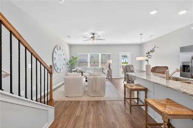 a view of a livingroom with furniture and a floor to ceiling window