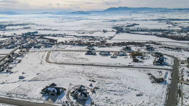 669 Cherry Ridge Lane, Unit 47 Richmond, UT 84333 - Photo 3 of 6 Snowy aerial view featuring a mountain view