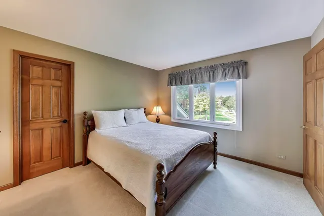 a bed room with a bed and window