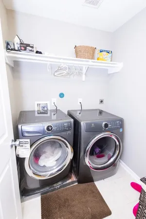 a utility room with dryer and washer