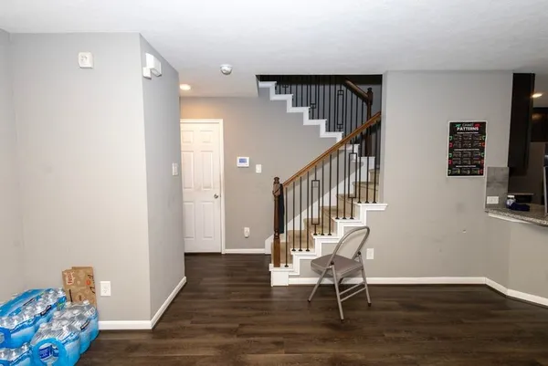 a view of entryway with wooden floor