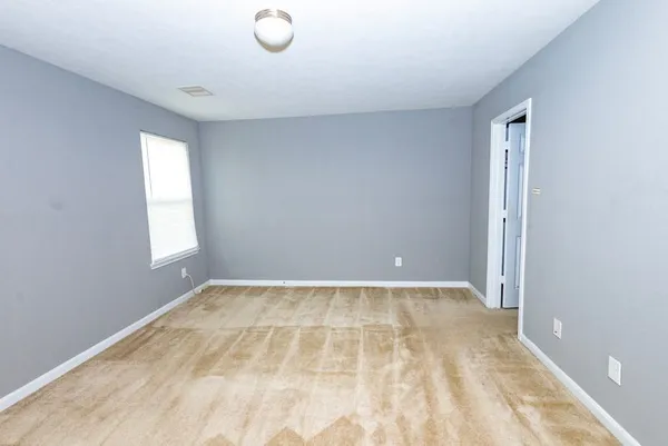 a view of an empty room and window
