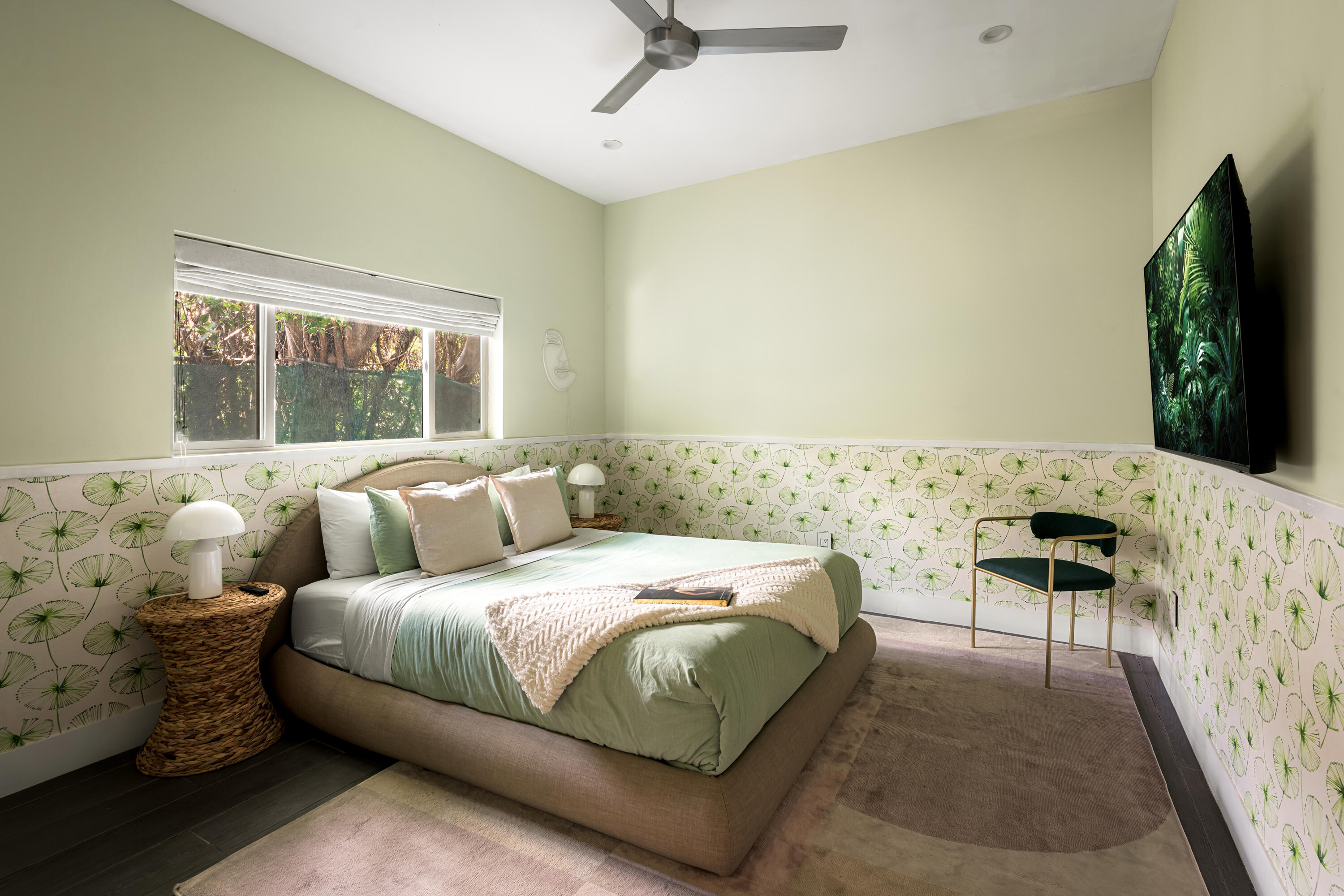 154 Ocotillo Avenue Palm Springs, CA 92264 - Photo 17 of 25 a bedroom with a bed and a flat screen tv